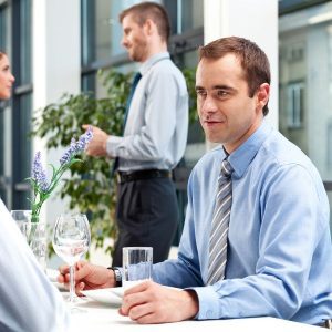 Business team discussing trends and news in a modern office.