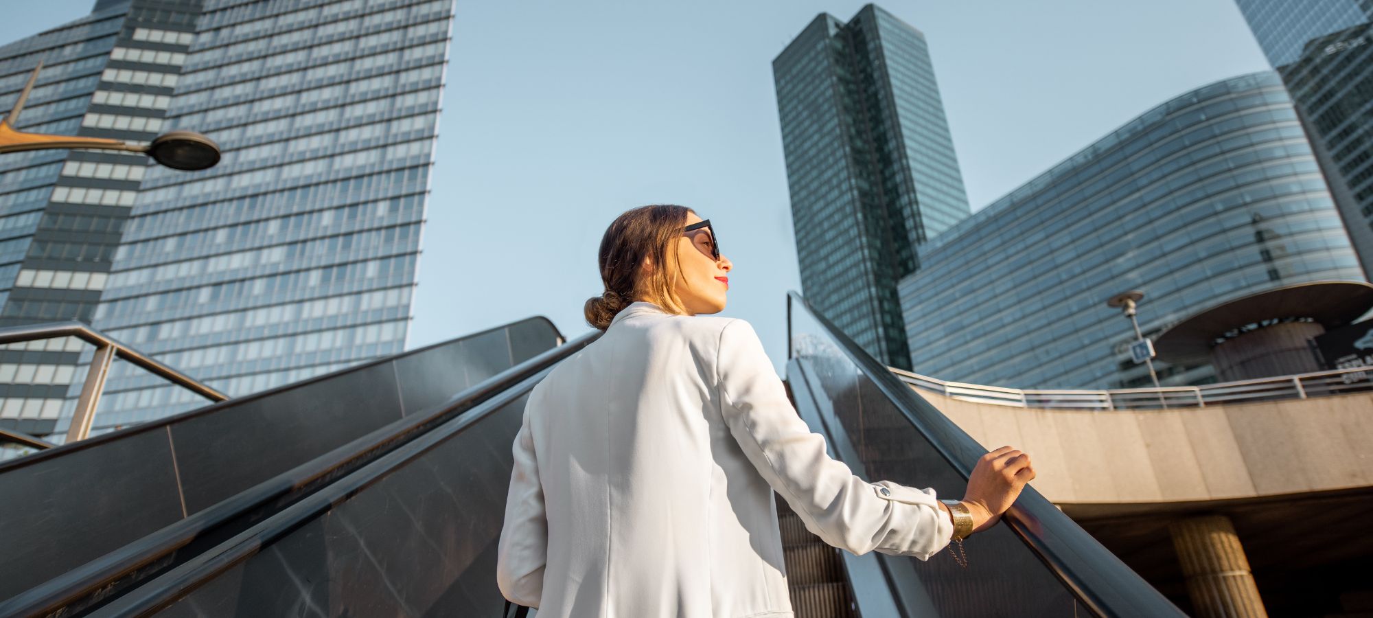 Business lady walking towards a global business hub.